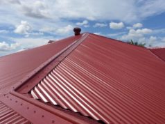Red Colorbond Metal Roof with the sky in the background